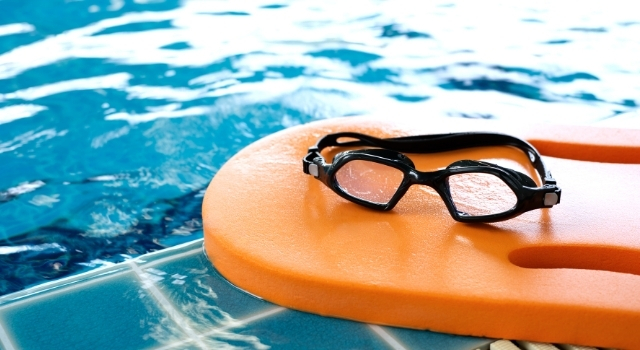 goggles by swimming pool - swim ms